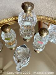 MaxSold Auction: Ornate Oval Mirrored Vanity Tray with Tocca Bottles - Raleigh (North Carolina, USA) PARTNER MANAGED Downsizing Online Auction -  Tipping Circle