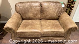 MaxSold Auction: Ashley PU Leather Loveseat  - Grimsby (Ontario, Canada) PARTNER MANAGED Downsizing Online Auction - Dorchester Drive              