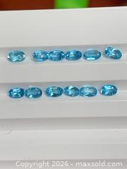 MaxSold Auction: 12 GENUINE (4.03ctw) AAA OVAL-CUT BRILLIANT BLUE TOPAZ GEMSTONES - Toronto (Ontario, Canada) PARTNER MANAGED Downsizing Online Auction - Queen Street East