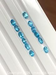 MaxSold Auction: 12 GENUINE (4.03ctw) AAA OVAL-CUT BRILLIANT BLUE TOPAZ GEMSTONES - Toronto (Ontario, Canada) PARTNER MANAGED Downsizing Online Auction - Queen Street East