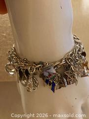 MaxSold Auction: Vintage 70s Sterling Silver Charm Bracelet with 28 Charms, 63g - Toronto (Ontario, Canada) SELLER MANAGED Downsizing Online Auction - O'connor Drive (CONDO)