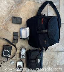 MaxSold Auction: Canon camera lot with carrying cases, 3 batteries, SD card - Oshawa (Ontario, Canada) SELLER MANAGED Estate Sale Online Auction -  Maddock