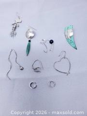 MaxSold Auction: Silver Single Earrings and Ear Cuffs - Toronto (Ontario, Canada) SELLER MANAGED Estate Sale Online Auction - Swanwick Avenue