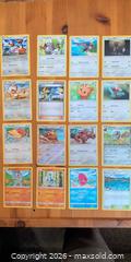 MaxSold Auction: 48 Pokémon Trading Cards — Mixed Sets, Various Rarities - Ottawa (Ontario, Canada) SELLER MANAGED Downsizing Online Auction - Regiment Avenue