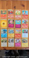 MaxSold Auction: Lot of 48 Pokémon Trading Cards, Mixed Commons & Energies - Ottawa (Ontario, Canada) SELLER MANAGED Downsizing Online Auction - Regiment Avenue