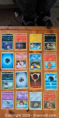 MaxSold Auction: Lot of 48 Pokémon Trading Cards, Mixed Commons & Energies - Ottawa (Ontario, Canada) SELLER MANAGED Downsizing Online Auction - Regiment Avenue