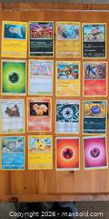 MaxSold Auction: Lot of 48 Pokémon Trading Cards, Mixed Commons & Energies - Ottawa (Ontario, Canada) SELLER MANAGED Downsizing Online Auction - Regiment Avenue