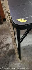 MaxSold Auction: 48in x 18in Black Plastic Folding Table with Metal Legs - Brighton (Ontario, Canada) SELLER MANAGED Estate Sale Online Auction - Drewery Street