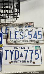 MaxSold Auction: Lot of 8+ License Plates with Metal Basket — Ontario & NWT - Brighton (Ontario, Canada) SELLER MANAGED Estate Sale Online Auction - Drewery Street