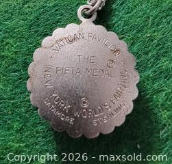 MaxSold Auction: Vintage NEW YORK WORLDS FAIR 1964 STERLING SILVER PIETA MEDAL CHARM  - East Cocalico Township (Pennsylvania, USA) SELLER MANAGED Downsizing Online Auction - Stevens Road