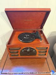 MaxSold Auction: Crosley Cherry Wood Multi-Format Turntable with Radio, CD, Cassette - Denver (Colorado, USA) SELLER MANAGED Estate Sale Online Auction - Greenwood Court