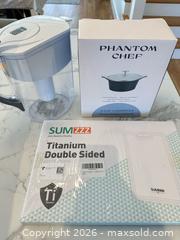 MaxSold Auction: Mixed Cookware Lot: Titanium Cutting Board, 2.3QT Casserole, Brita Water Pitcher - Arlington (Virginia, USA) SELLER MANAGED Downsizing Online Auction - 8th Street North