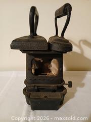 MaxSold Auction: Antique Cast Iron Sad Iron Stove – McClary Mfg. Co. with Two Flat Irons, sold as is - Kingston (Ontario, Canada) SELLER MANAGED Estate Sale Online Auction - Tamarac Street