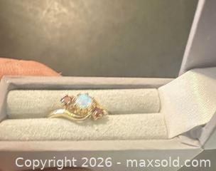 MaxSold Auction: 9 ct Yellow Gold Opal Ring with Garnet Side Stones - Calgary (Alberta, Canada) SELLER MANAGED Moving Online Auction - Varsville Place Nw