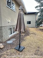 MaxSold Auction: Brown/Taupe Patio Umbrella with Base, 7–9 ft - Calgary (Alberta, Canada) SELLER MANAGED Moving Online Auction - Varsville Place Northwest