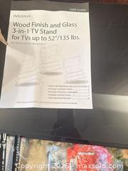 MaxSold Auction: Insignia TV Stand for Up to 52" TVs, Black Glass & Brown Finish - Calgary (Alberta, Canada) SELLER MANAGED Moving Online Auction - Varsville Place Nw