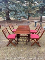 MaxSold Auction: Outdoor Patio Dining Set — Wood Table with 4 Folding Chairs - Calgary (Alberta, Canada) SELLER MANAGED Moving Online Auction - Varsville Place Nw