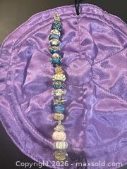 MaxSold Auction: Trollbeads European Bead-Style Charm Bracelet with Glass Lampwork & Silver - Calgary (Alberta, Canada) SELLER MANAGED Moving Online Auction - Varsville Place Northwest