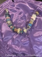 MaxSold Auction: Trollbeads European Bead-Style Charm Bracelet with Glass Lampwork & Silver - Calgary (Alberta, Canada) SELLER MANAGED Moving Online Auction - Varsville Place Northwest