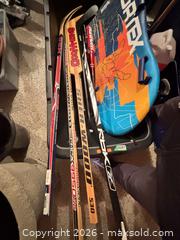 MaxSold Auction: Assorted Hockey Sticks, Baseball Bats & Bodyboard - Toronto (Ontario, Canada) SELLER MANAGED Downsizing Online Auction - Joicey Boulevard