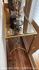 MaxSold Auction: Modern Gold Brass Metal Frame Console Table with Glass Top - Toronto (Ontario, Canada) SELLER MANAGED Downsizing Online Auction - Joicey Blvd 