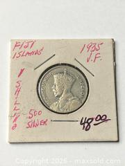 MaxSold Auction: 1935 Fiji 1 Shilling Silver Coin - Esquimalt (British Columbia, Canada) PARTNER MANAGED Reseller Online Auction -  Lampson Street