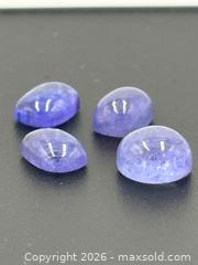 MaxSold Auction: Tanzanite Cabochon Gemstones 5.5 Carats   - Esquimalt (British Columbia, Canada) PARTNER MANAGED Reseller Online Auction -  Lampson Street