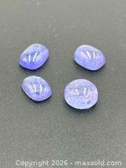MaxSold Auction: Tanzanite Cabochon Gemstones 5.5 Carats   - Esquimalt (British Columbia, Canada) PARTNER MANAGED Reseller Online Auction -  Lampson Street