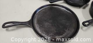 MaxSold Auction: Cast Iron Frying Pans and Flat Griddle - Pelham (Ontario, Canada) SELLER MANAGED Reseller Online Auction - Foss Road