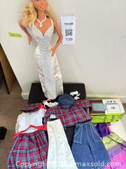 MaxSold Auction: Barbie 18 in Doll with Assorted Clothes & Small Vintage Souvenir Doll - New Westminster (British Columbia, Canada) PARTNER MANAGED Downsizing Online Auction -  Jamieson Court (CONDO)