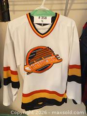 MaxSold Auction: Vintage Vancouver Canucks Trevor Linden White "Flying Skate" CCM Jersey - West Vancouver (British Columbia, Canada) SELLER MANAGED Estate Sale Online Auction - Marine Drive