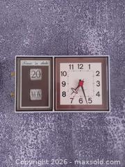 MaxSold Auction: Vintage 1970s Westclox “Time ’N Day-Date” Electric Wall Clock, Made in Canada, 10" x 6" - Toronto (Ontario, Canada) SELLER MANAGED Reseller Online Auction - Esandar Drive (STORAGE)