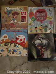 MaxSold Auction: Mixed Lot: 12" LPs, Book & Record Sets, Wooden Boomerang - Marietta (Georgia, USA) PARTNER MANAGED Estate Sale Online Auction - Casteel Park Drive Southwest