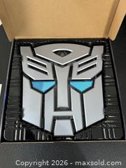 MaxSold Auction: Transformers: The Covenant of Primus hardcover book encased in an Autobot emblem with sound effects  - Marietta (Georgia, USA) PARTNER MANAGED Estate Sale Online Auction - Casteel Park Drive Southwest