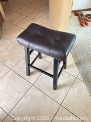 MaxSold Auction: Backless Dark Brown Faux Leather Counter Stool with Black Wood Legs - Sun City (Arizona, USA) PARTNER MANAGED Estate Sale Online Auction - West Jacaranda Drive