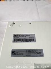 MaxSold Auction: Brother PT-2400/PT-2410 and PT-330 Label Makers (Two Units) - Campbell (California, USA) PARTNER MANAGED Downsizing Online Auction - Dell Avenue