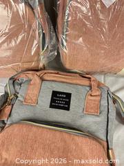 MaxSold Auction: LAND Pink & Gray Polyester Backpack (Lot of 3) - Campbell (California, USA) PARTNER MANAGED Downsizing Online Auction - Dell Avenue