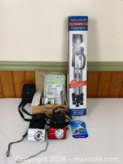 MaxSold Auction:  Compact Digital Camera with Tripod - Clarence-Rockland (Ontario, Canada) PARTNER MANAGED Estate Sale Online Auction - Campeau Crescent