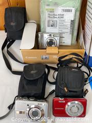 MaxSold Auction:  Compact Digital Camera with Tripod - Clarence-Rockland (Ontario, Canada) PARTNER MANAGED Estate Sale Online Auction - Campeau Crescent