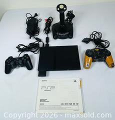 MaxSold Auction: Sony PlayStation 2 Console with ThrustMaster XL Joystick & Controllers - Clarence-Rockland (Ontario, Canada) PARTNER MANAGED Estate Sale Online Auction - Campeau Crescent