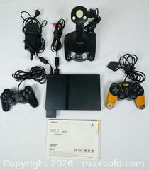 MaxSold Auction: Sony PlayStation 2 Console with ThrustMaster XL Joystick & Controllers - Clarence-Rockland (Ontario, Canada) PARTNER MANAGED Estate Sale Online Auction - Campeau Crescent