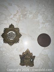 MaxSold Auction: Early 20th C Canadian Cap & Lapel Badges with Medal/Token - Point Edward (Ontario, Canada) SELLER MANAGED Estate Sale Online Auction -  Michigan Avenue
