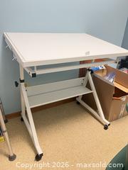 MaxSold Auction: White Metal PuzzleTable with Adjustable Tilt & Wheels - Point Edward (Ontario, Canada) SELLER MANAGED Estate Sale Online Auction -  Michigan Avenue