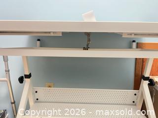 MaxSold Auction: White Metal PuzzleTable with Adjustable Tilt & Wheels - Point Edward (Ontario, Canada) SELLER MANAGED Estate Sale Online Auction -  Michigan Avenue