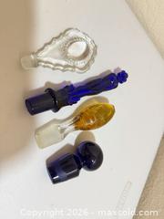 MaxSold Auction: Set of 4 Glass Perfume/Decanter Bottle Stoppers - Cupertino (California, USA) SELLER MANAGED Downsizing Online Auction - Rollingdell Drive (CONDO)