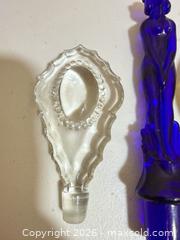 MaxSold Auction: Set of 4 Glass Perfume/Decanter Bottle Stoppers - Cupertino (California, USA) SELLER MANAGED Downsizing Online Auction - Rollingdell Drive (CONDO)