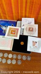 MaxSold Auction: Y2K Stamp And Coin Set + Canada Half Dollars  - Hamilton (Ontario, Canada) SELLER MANAGED Estate Sale Online Auction - Gertrude Street