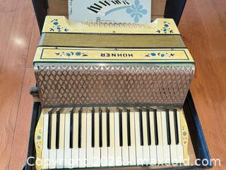 MaxSold Auction: Hohner Accordion with Piano-Style Keyboard, Yellow/Cream & Black hard case - Victoria (British Columbia, Canada) PARTNER MANAGED Estate Sale Online Auction - Haida Drive