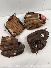 MaxSold Auction: 4 baseball mitts and 15 baseballs - Hanover Township (Pennsylvania, USA) PARTNER MANAGED Downsizing Online Auction - Airport Road (STORAGE)              