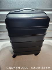 MaxSold Auction: Skyline Hard Suitcase - Hanover Township (Pennsylvania, USA) PARTNER MANAGED Downsizing Online Auction - Airport Road (STORAGE)              